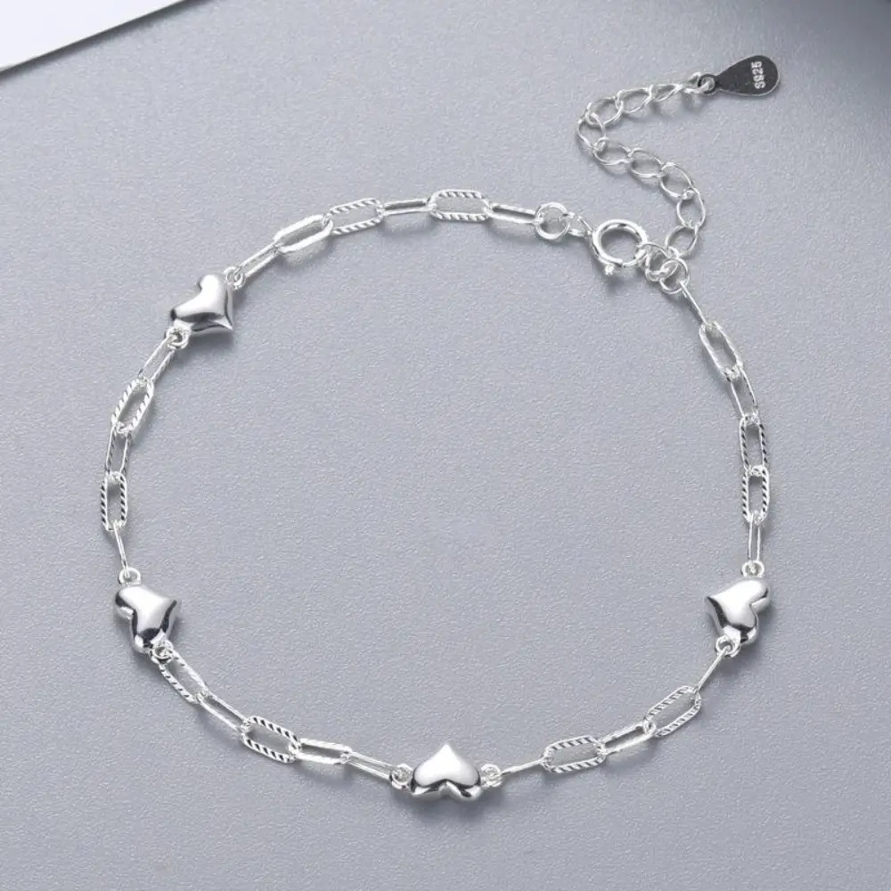 This S925 sterling silver bracelet features a simple heart design, making it a stylish and versatile accessory for women and girls, and a beautiful and unique birthday gift.