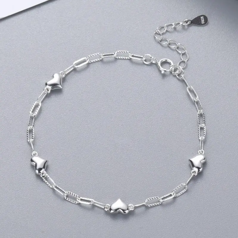 This S925 sterling silver bracelet features a simple heart design, making it a stylish and versatile accessory for women and girls, and a beautiful and unique birthday gift.