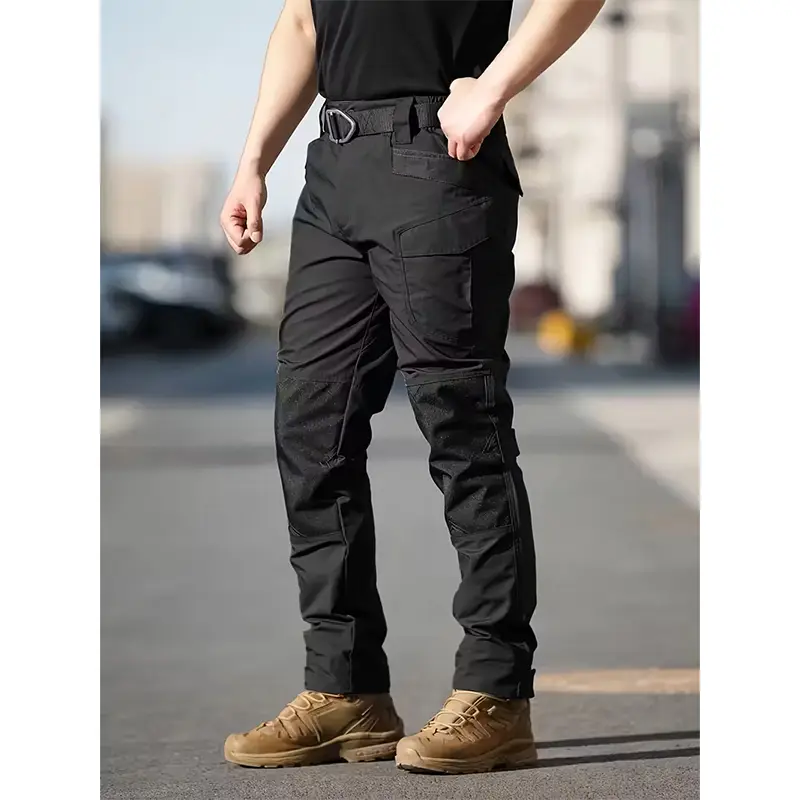 HOMUG Men's Solid Color Zippered Waterproof Tactical Work Pants feature a wide stretch waistband and a tailored waterproof tactical design. Ideal for spring and summer wear, these are durable pants specially designed for men engaged in outdoor training. S