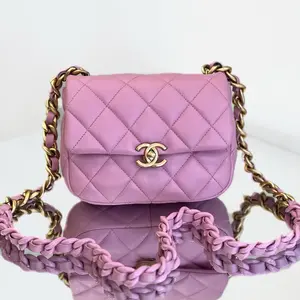 Pre-owned Coated Canvas shoulder bag Chanel Pink Quilted Leather Mini Round Flap Bag with Braided Leather Chain & Gold Tone Hardware
