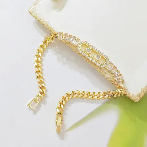 Women's Elegant Gold-Plated Cuban Link Bracelet - Costume Jewelry for Women with Sparkling CZ Sliding Charm, Baguette Zircon Glow, Cubic Zirconia Inlay, Metal Coating, Dainty Adjustable Design for Daily Wear, Gifting, CZ Stones Add Bright Sparkle