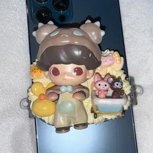 Phone Clips with Figurines Featuring Unique Design and Vibrant Colors for Stylish Accessory. Fits any phone size