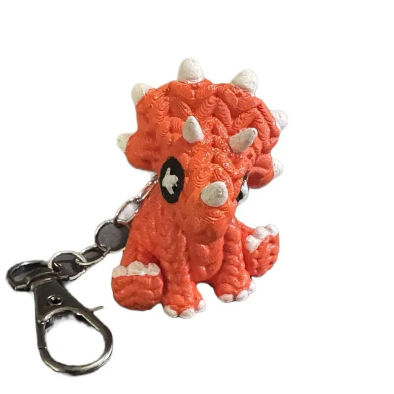 Cute Knitted Triceratops Keychain - Orange Knit Design with White Accents and Metal Clip Attachment