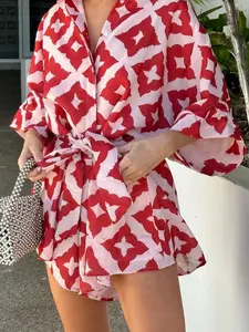 A women's shirt-style Tie Waist romper with red and white geometric prints and tie details, featuring bright colors and a loose fit for a trendy, casual vibe. Perfect for summer beach vacations, city street dates, or relaxed get-togethers with friends.