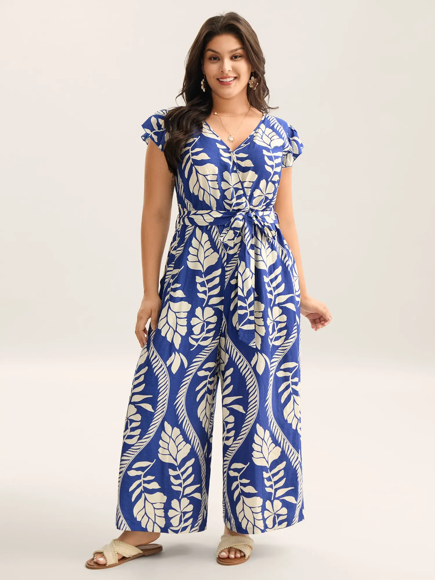 BloomChic Women's Plus Size Fitted Boho Belted Cami Jumpsuit - Floral Print, Cap Sleeve, Nylon, Low Iron, Pockets, Belt, Flower Print Romper, Curvy Clothing [M-6X] 2026 Summer Overalls, Bohemian, Rayon Blend, Boho Print