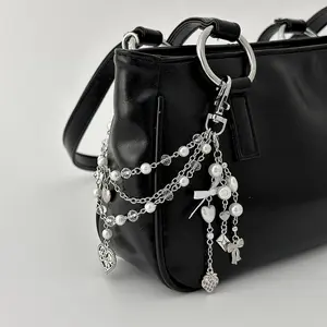 Sweet and cool imitation pearl beaded bag pendant, creative love bow fringed bag chain pendant