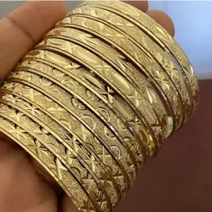 Elegant Gold-Tone Engraved Bangle Set - 12-Piece Stackable Bracelets for Women's Fashion Accessories . Indian gold