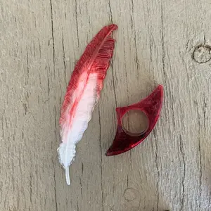 Feather book mark and thumb page holder