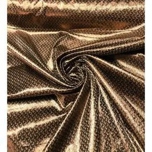 Gold matalic Jaquard think brocade 45” wide. Beautiful bronze gold brocade used for apparel & home Decore. Sold by the yard