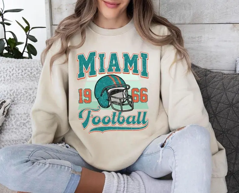 🔥 Cream Miami Dolphins Football Sweatshirt | Vintage Sports Graphic | Soft Oversized Unisex Hoodie | Trendy Streetwear Style for Men & Women | Comfortable, Cozy & Eye-Catching | Perfect for Daily Wear or Game Day Fashion 💥
