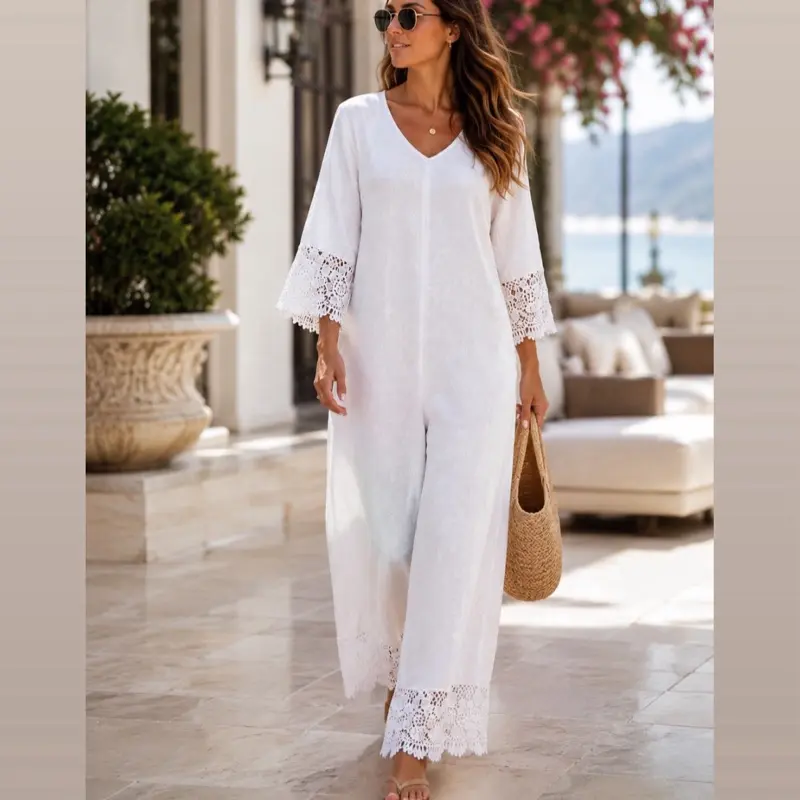 Zoe Wide Leg Jumpsuit with Intricate Crochet Trim on Sleeves and Pant Cuffs V-Neckline Linen One Size Ideal for Summer or Resort Wear Available in White Light Blue Light Pink and Yellow