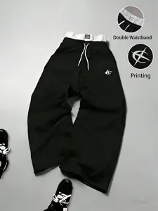 Gray sweatpants with embroidered logo, Y2K American street casual joggers, loose casual knitted sports pants featuring a drawstring and faux two-piece design with contrasting double waistband, perfect for everyday wear and trendy gatherings.