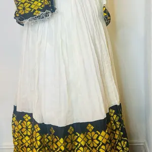 Ethiopian Traditional Dress with Yellow Floral Patterns and White Center Cultural Fashion Wear for Ethnic Style Womenswear Casual Summer Elegant Long Sleeve Trend Everyday