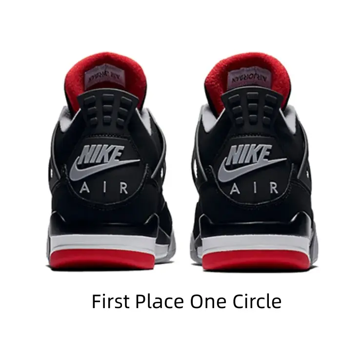 Iconic Black Mid-Top Basketball Sneakers with Red Accents and Grey Overlays for Streetwear