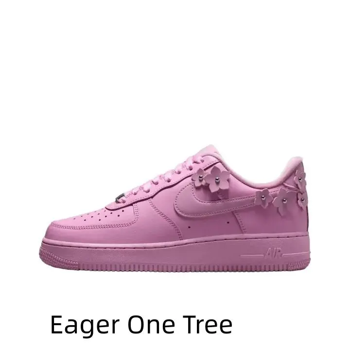 Unisex hip-hop low-top casual sports sneakers in solid pastel pink leather, 3D flower ornament on side, perforated breathable toe, shock-absorbing soft insole and full pink wear-resistant rubber outsole.