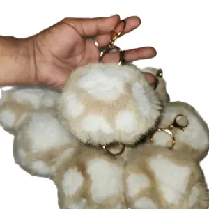 Puppy Paw Keychain Soft Fuzzy Design for Cute Accessories with Gold Ring and Adorable White Spots