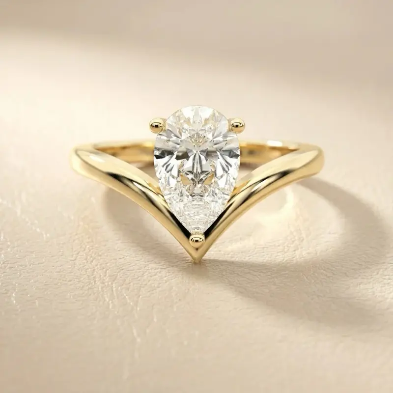 Bezel set vivid pink pear shape in 14k yellow gold setting size 6