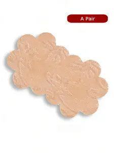 A pair of skin-tone flower shape lace nipple covers,  with a seamless patch design, providing comfortable and reusable protection for nipples, gentle on the skin.  specially designed for matching strapless dresses and halter neck skirts to prevent bumps.