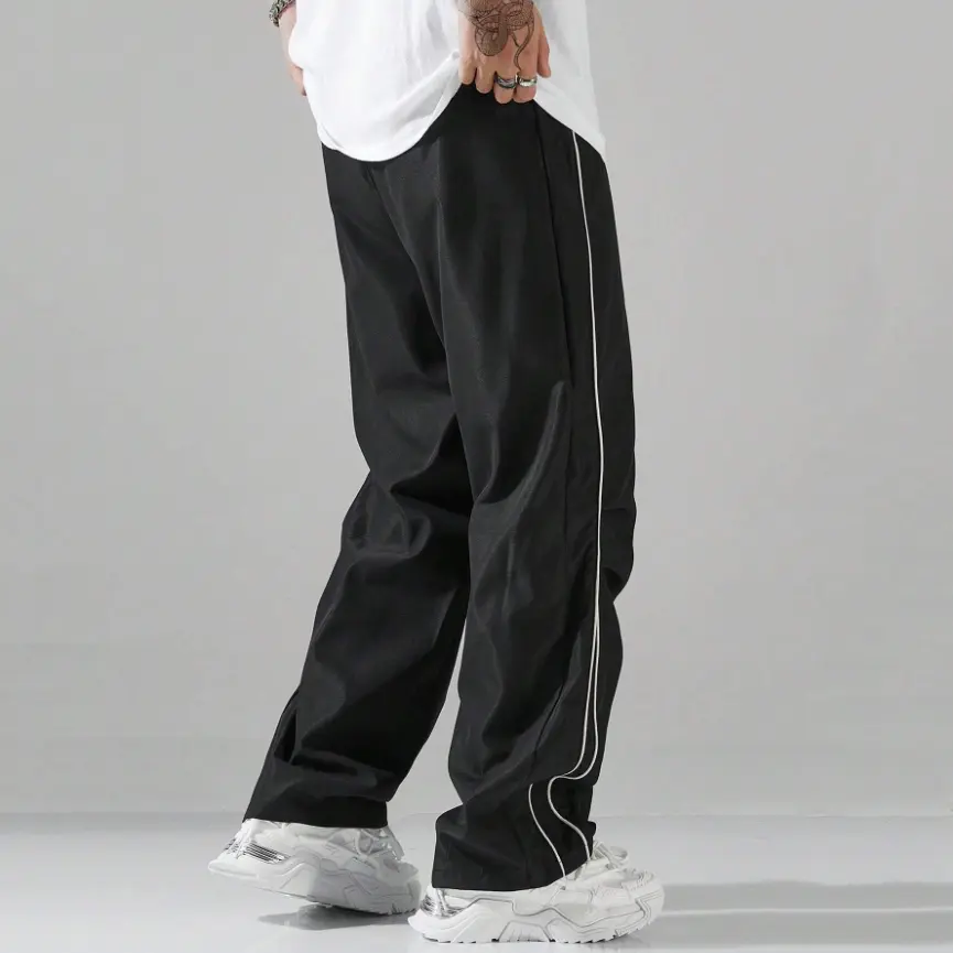 Unisex baggy wide-leg sweatpants; men’s casual athletic pants made from soft fabric with an elastic waistband and drawstring; loose fit with side stripes; breathable, lightweight sports fitness streetwear pants; all-day comfort and versatile for everyday Unisex baggy wide-leg sweatpants; men’s casual athletic pants made from soft fabric with an elastic waistband and drawstring; loose fit with side stripes; breathable, lightweight sports fitness streetwear pants; all-day comfort and versatile for everyday