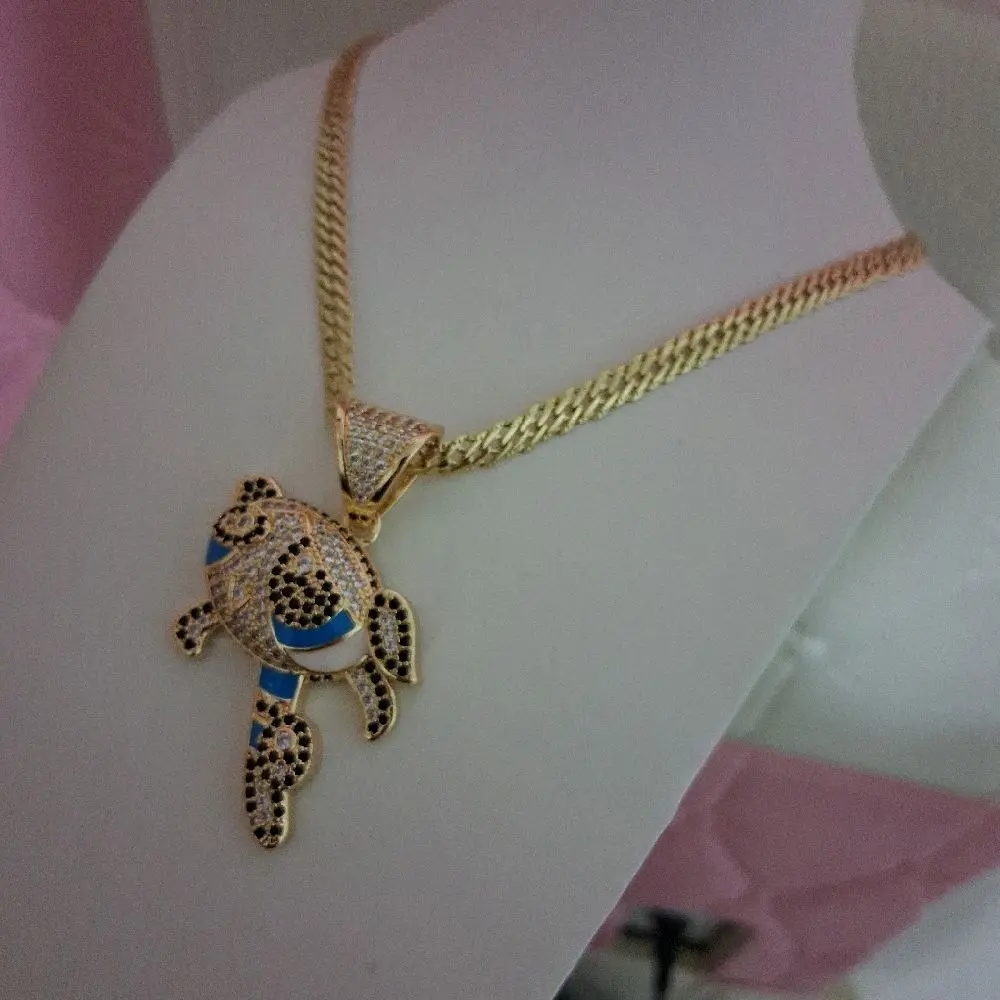 Spanish style chain 6mm thick by 18 inches 14 k gold laminated with cartoon pendant.