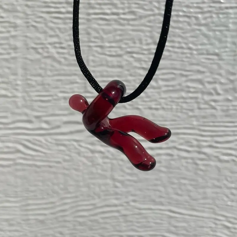 handmade glass “hangin’ in there” pendant