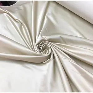 Beautiful champagne egg shell color silk rayon Satin 48” wide.  Best used for bridal dresses sold by the yard