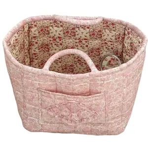 Quilted cotton floral-patterned piece with a sweet and fresh vibe, featuring an elegant appearance and lightweight body. This foldable handheld item doubles as a dirty clothes basket, storage box and snack basket