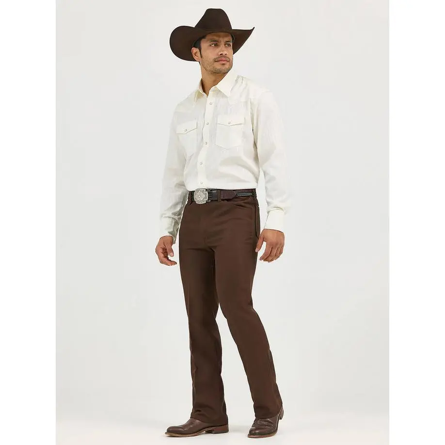 Wrangler Mens Wrancher Dress Jean (SIZE UP, GARREN UNA TALLA MAS) -Brown