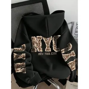 Unisex fashion black hoodie with a New York City leopard print pattern, an oversized, comfortable pullover—trendy streetwear for teens and adults, a perfect choice for autumn and winter casual wear. GARMENTARY