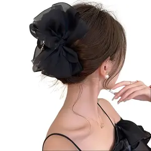 A new fairy-like hair clip made of mesh material in a milky coffee color, with a fairy-like bow. The trendy mesh hair clip is light and airy, without any sense of constraint. Just clip it on and you'll instantly have a beautiful, voluminous back of the he