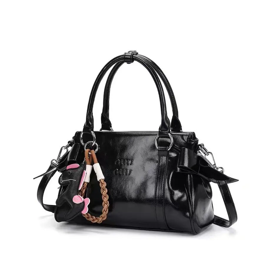 Black large-capacity cowhide shoulder bag with multiple compartments, can be carried by hand