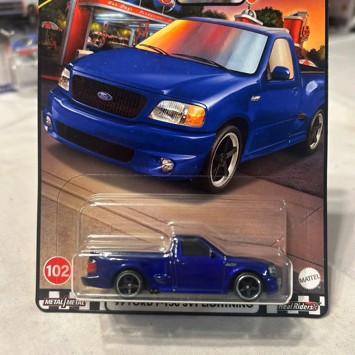 Hotwheels Premium Boulevard 99 Ford SVT Lightning. Has soft edge near blister.!!!