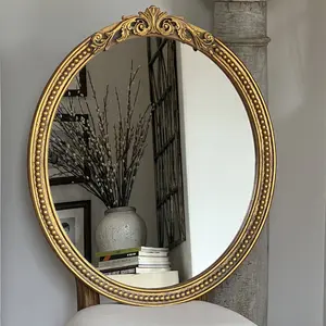 Elegant Oval Wall-mounted Decorative Mirror With Intricate Gilded Border