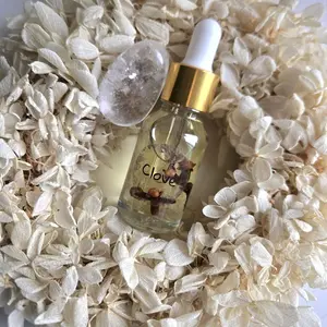 Clove oil infused with clear quartz crystal,High Positive vibes,Aromatherapy fragrances.