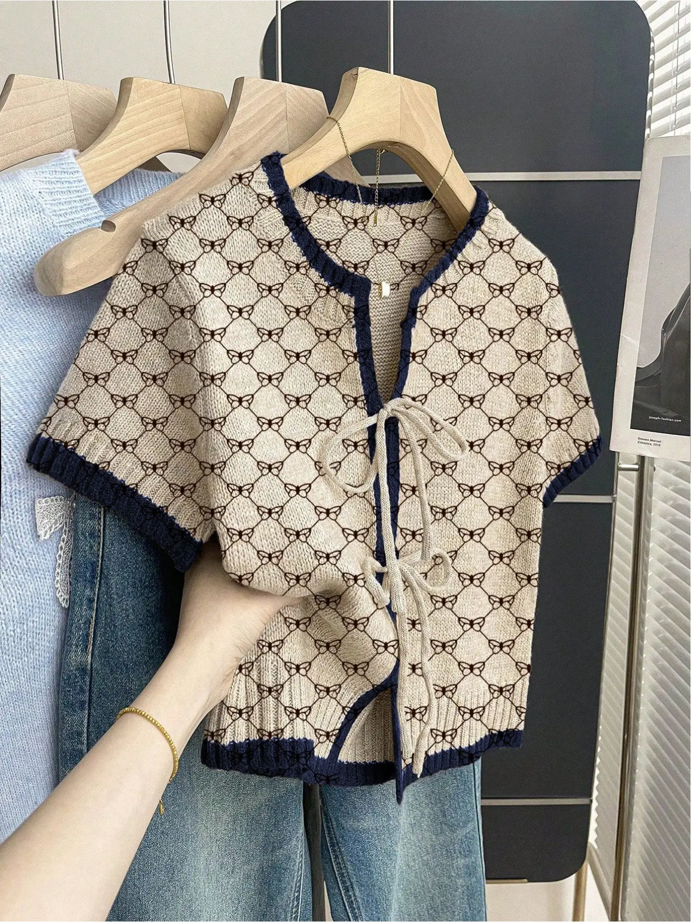 Women's khaki Bohemian Inspired vacation short-sleeve knit top. Loose round neck, geometric print, front tie and contrast piping. Comfortable for spring & summer casual wear. Casual Boho Breathable Casual Boho Soft Boho Style Shirt Boho Fashion Top