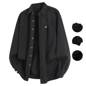 Long-sleeve shirt featuring a relaxed fit, dual chest pockets, and subtle badge detail