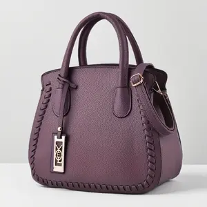 Fashionable women's handbag - elegant purple diagonal backpack and shoulder bag with woven details and zipper closure, perfect for casual or formal occasions