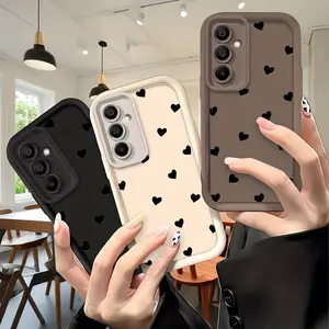 for Samsung S25.Fashionable and Minimalist Black Heart-shaped Sky Eye Ladder Shockproof Lens Protector Case. Suitable for Samsung Galaxy A35, A55 5G, A33, A34, A07, A06, A36, A05 4G, A05S, A17, A54, A53, A52s, A12, A13, A26, A25, A15, A14, A56, A16