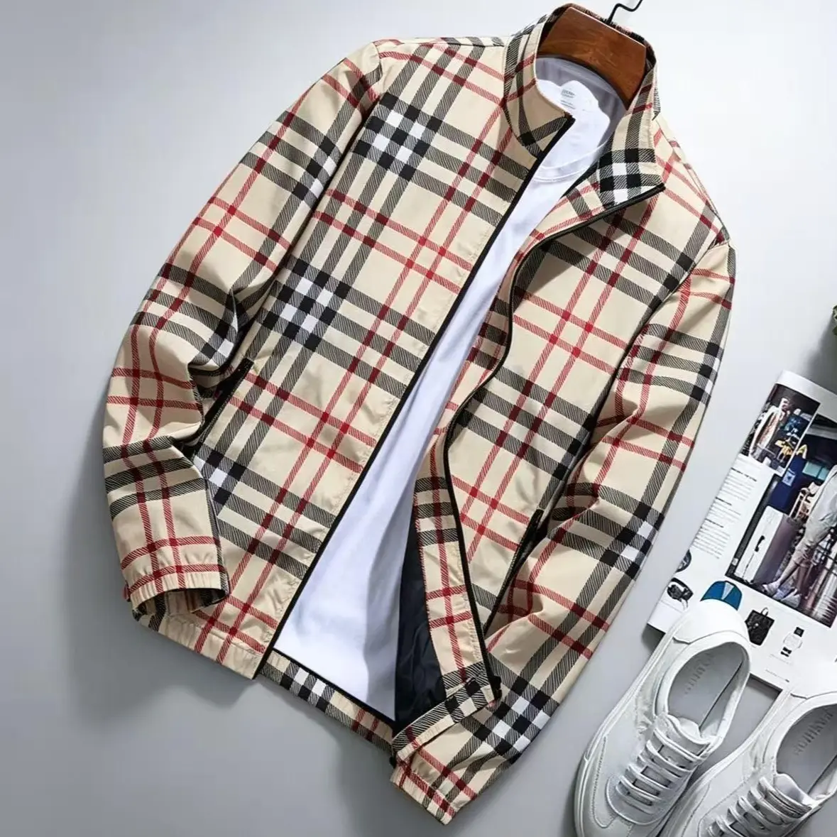 Men’s spring/autumn fashion jacket—lightweight hooded outerwear available with a stand collar and zip closure; windproof design featuring adjustable drawstrings and contrasting stripe patterns; men’s outerwear in khaki plaid style.