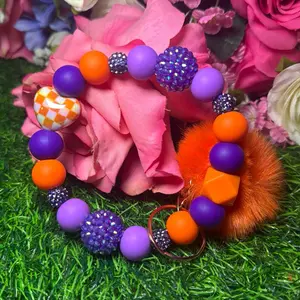 Mystery girl Wristlet Keychain color scheme purple, orange and bling beads made with wire