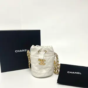 Pre-owned CHANEL Caviar Quilted Twist Your Buttons Mini Bucket Bag White |N21766683