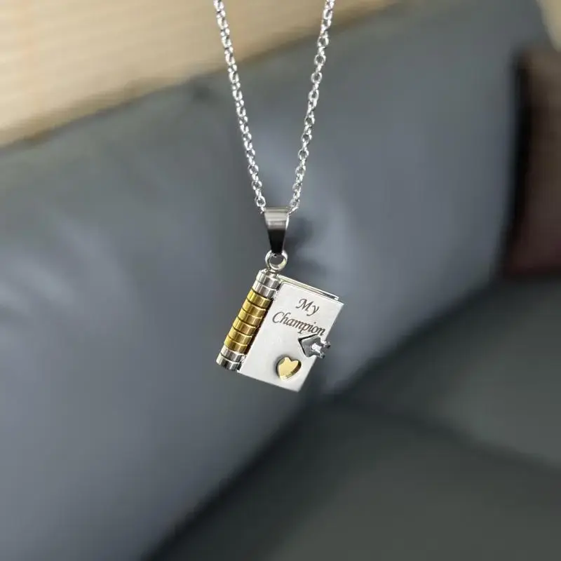 "My Champion" Necklace - Gold & Silver Metal Pendant with Heart & Book Design, Perfect Gift for Graduation, Birthday, or Special Occasion, Graduation Jewelry | Heart Motif Pendant | Durable Plastic Pendant, Teenager Necklace, For Teenager