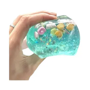 Healing green jelly texture squeeze toy, Squishies, Stress Relief Sculptures, wrapped in shells and starfish, mini ocean gadgets, soft jelly, decompression and relaxation, desktop ornaments, relieving stress and creating a summer atmosphere