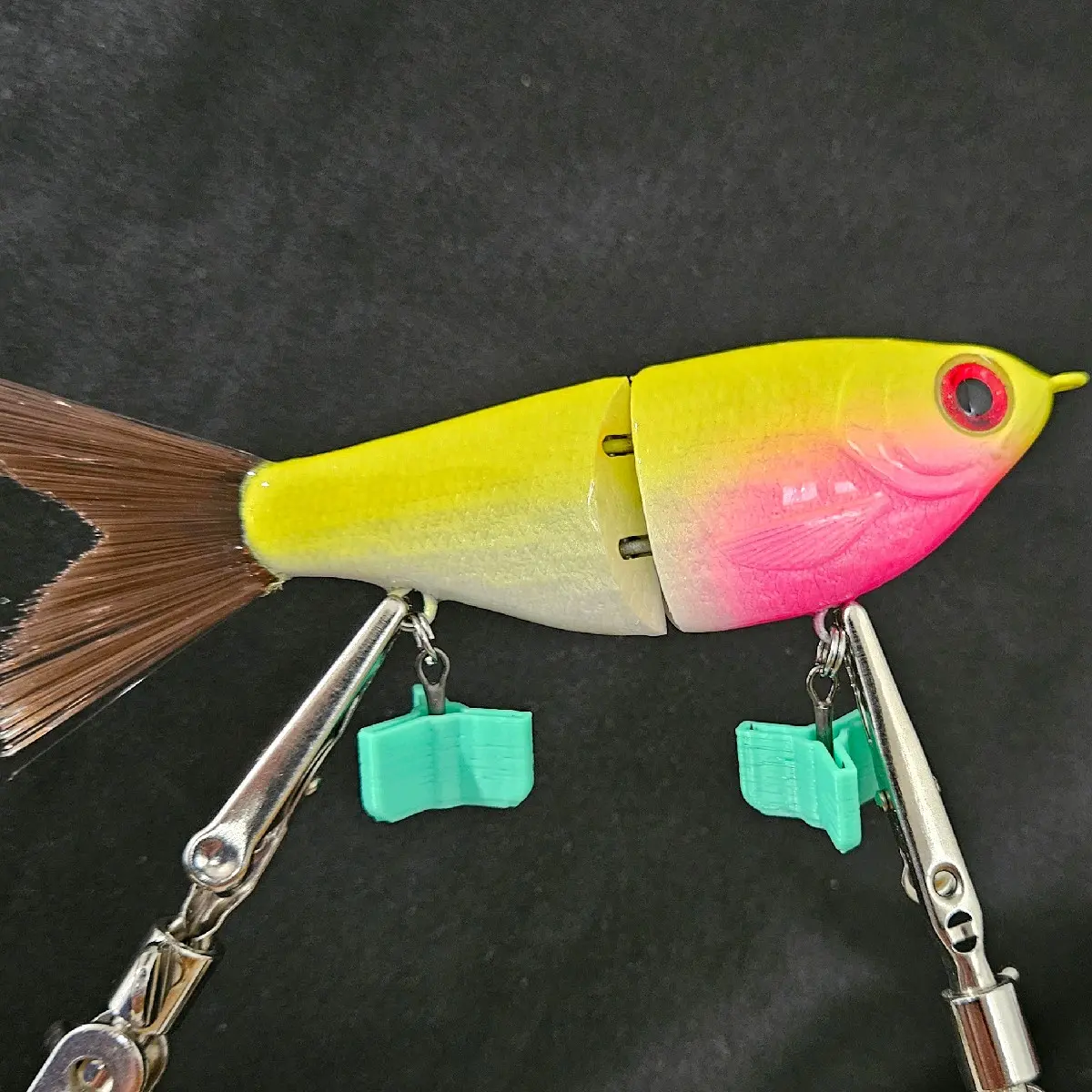 5 Inch Glide Bait with Brush Tail and VMC Treble Hooks. Thie glide is slow sinking, just under 5 inches from noes to the tip of the tail and weighs 1/2 OZ