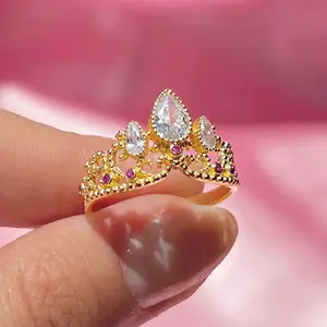 Princess Crown Ring with Decorative Stones, Gold Finish, and Elegant Design