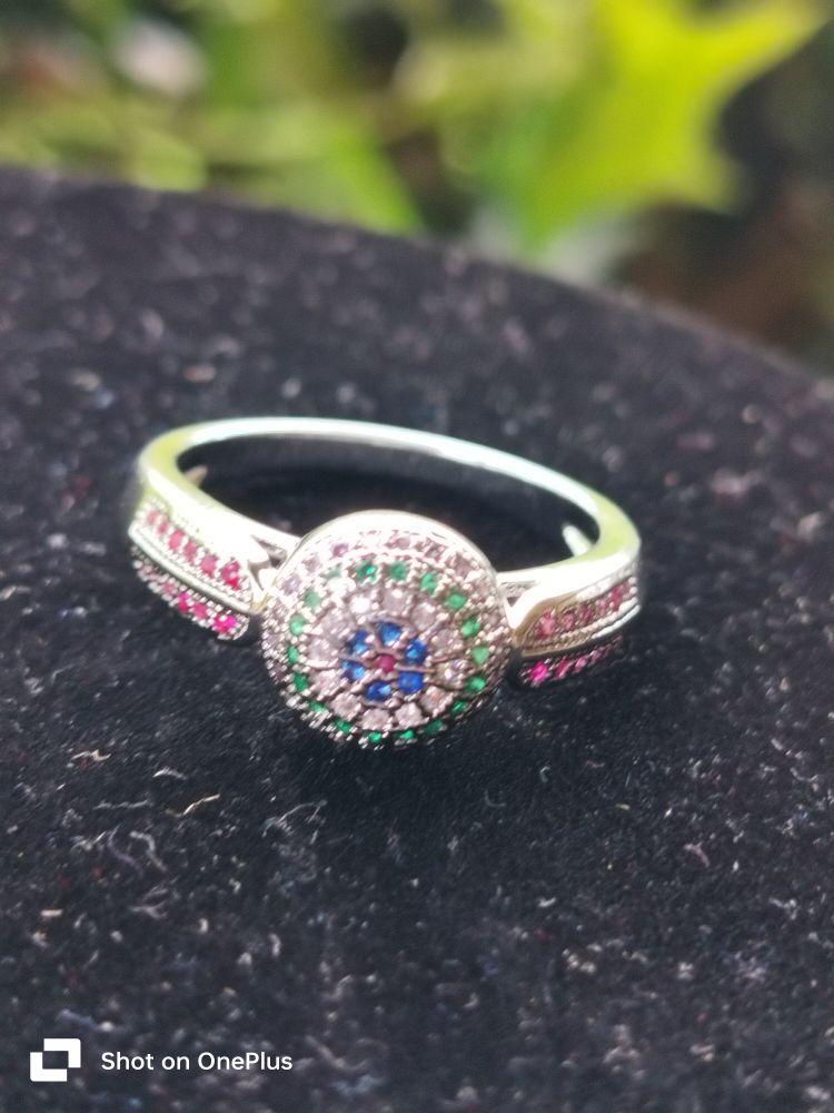 Sterling Silver Ring with Ruby, Sapphire & Emerald Accents, Featuring Central Stone and Decorative Band