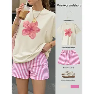 Popular Y2K Aesthetic Apricot Hibiscus Pattern T-Shirt and Pink Striped Casual Shorts Set | Summer Beach Outfit, Soft Blended Cotton, Loose Fit for Women GARMENTARY