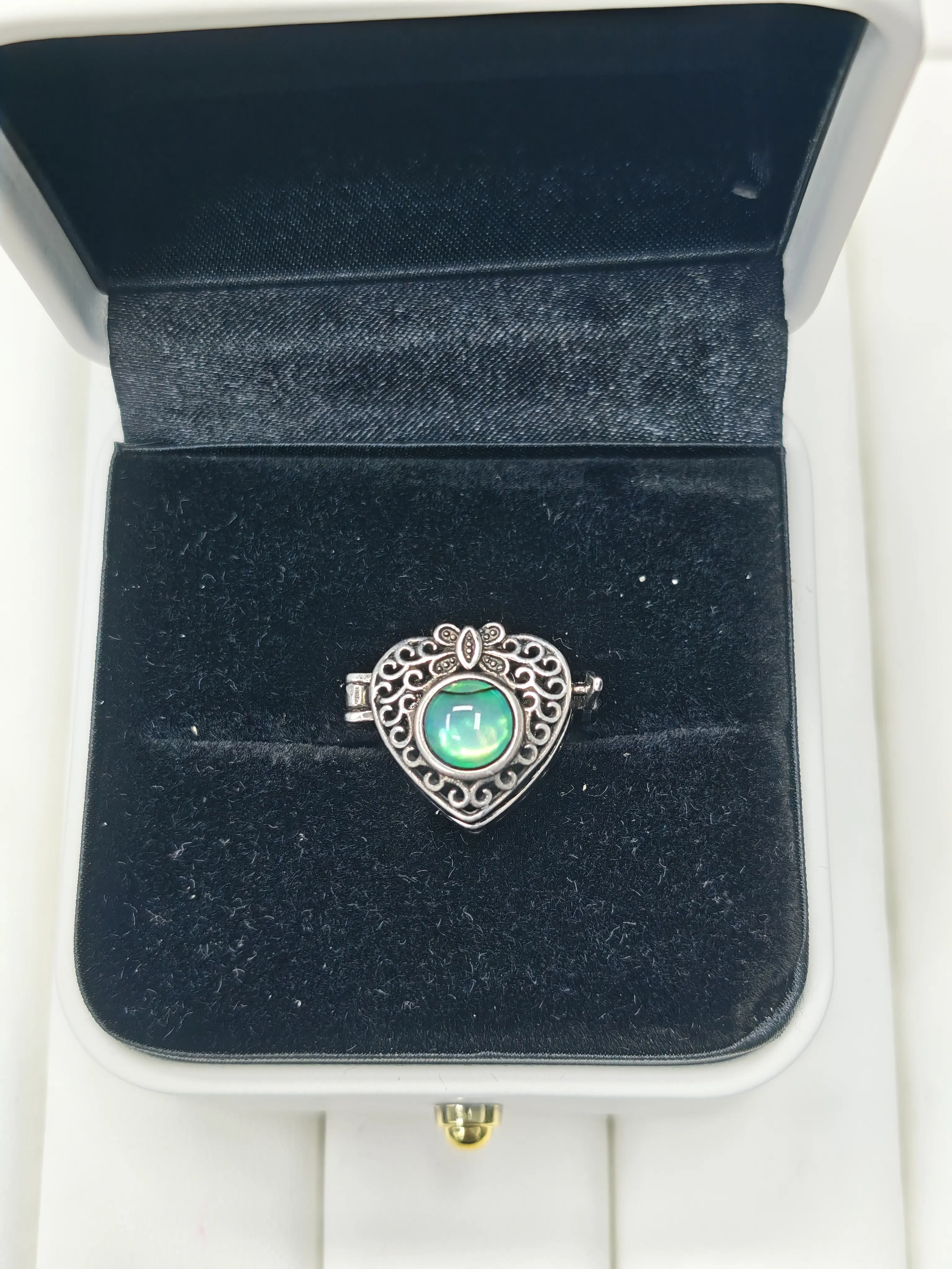 Casha(17843)gc. Vintage heart locket ring with opal, antique silver finish, hollow carving and butterfly detail.