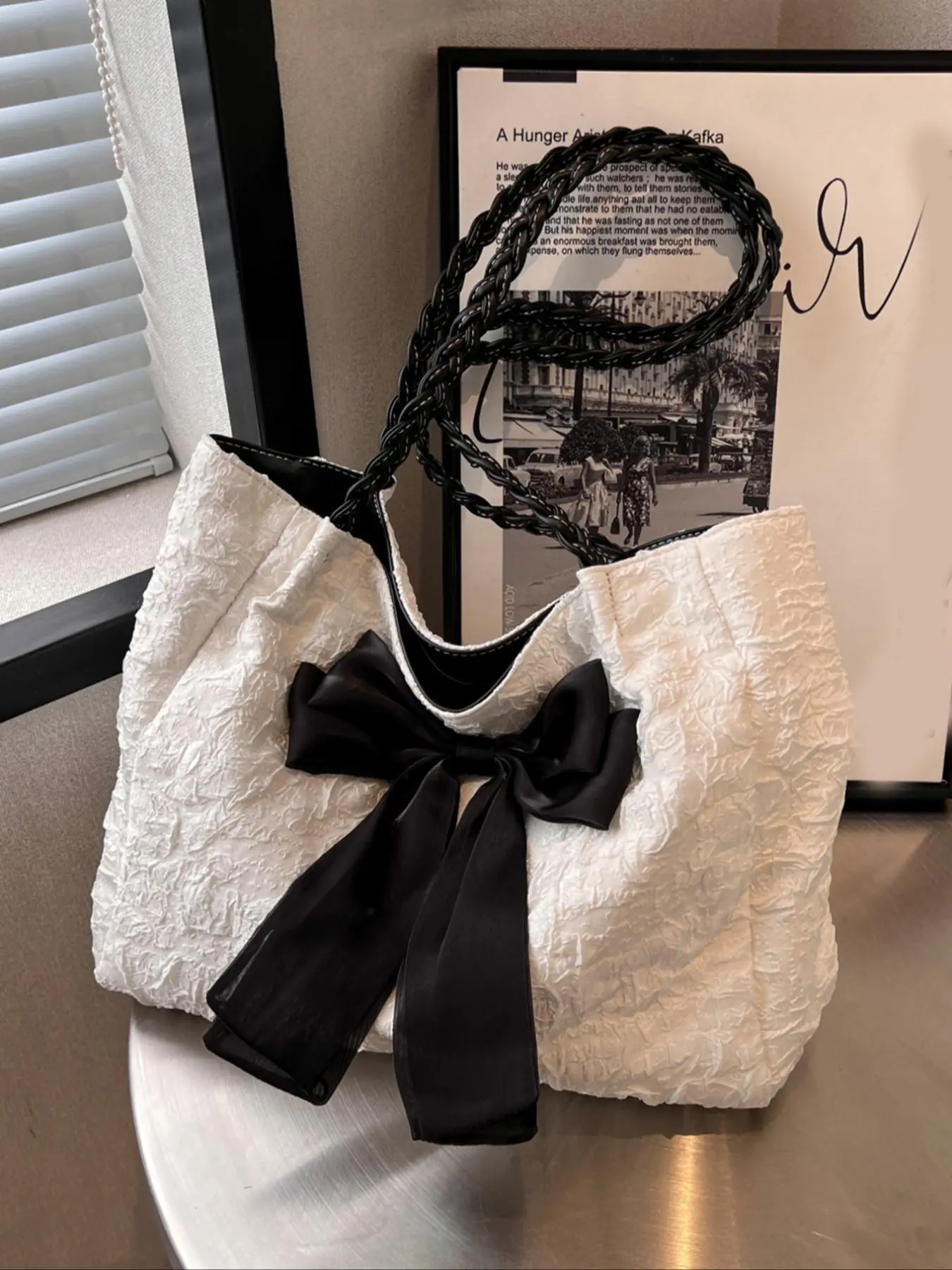 Sweet  cool three-dimensional embossed bag, black bow niche design bag, textured black and white contrast, fashionable and exquisite, stylish bag, versatile and large capacity, suitable for students, office workers, commuting, etc. Embossed Shoulder Bag