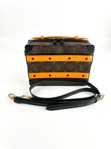 Pre-owned Louis Vuitton rown Monogram coated canvas with black hardware. Gold tone hardware in the strap. Tangerine leather stripes. Crossbody Bags BROWN HANDLE MONOGRAM SOFT TRUNK